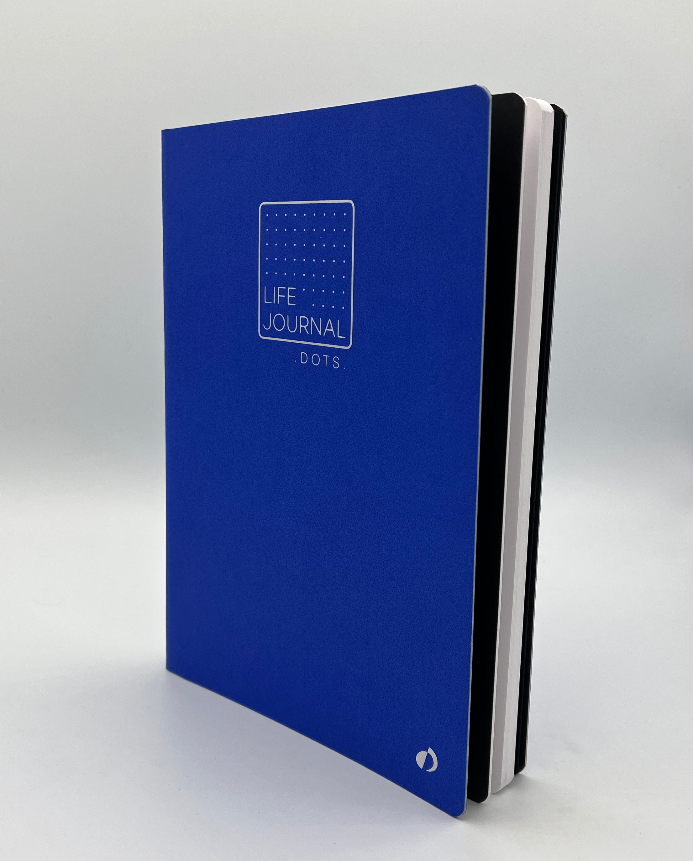 Blue journal with 'Life Journal Dots' on a gray background