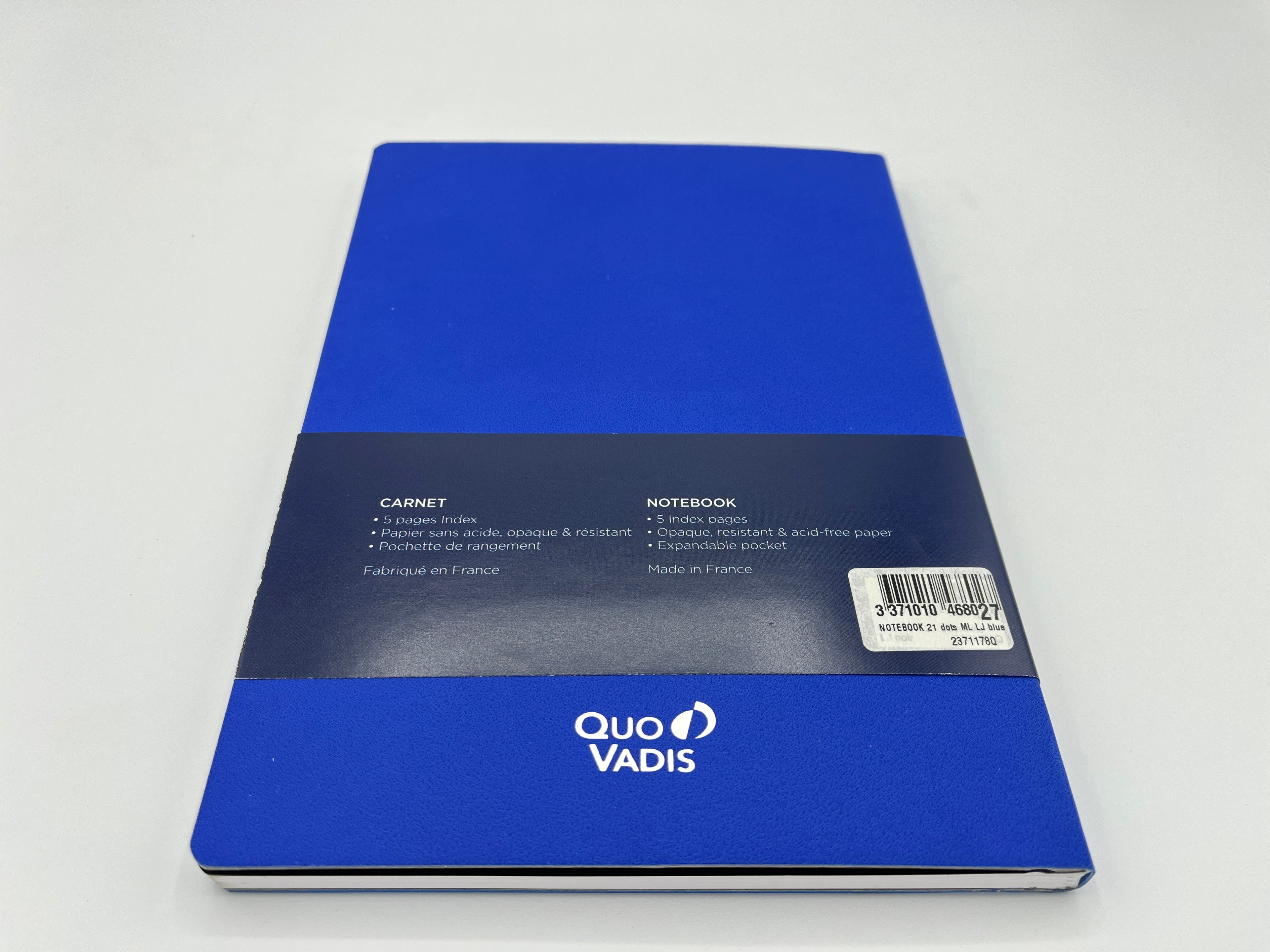 Blue notebook with 'Quo Vadis' branding on a white background
