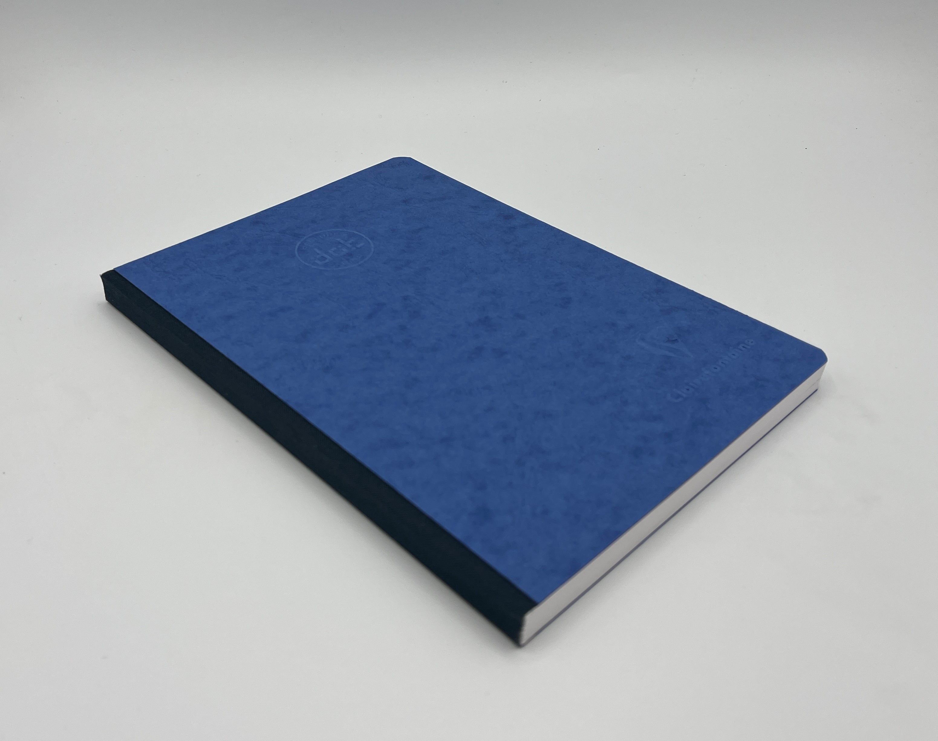 Blue notebook on a gray background