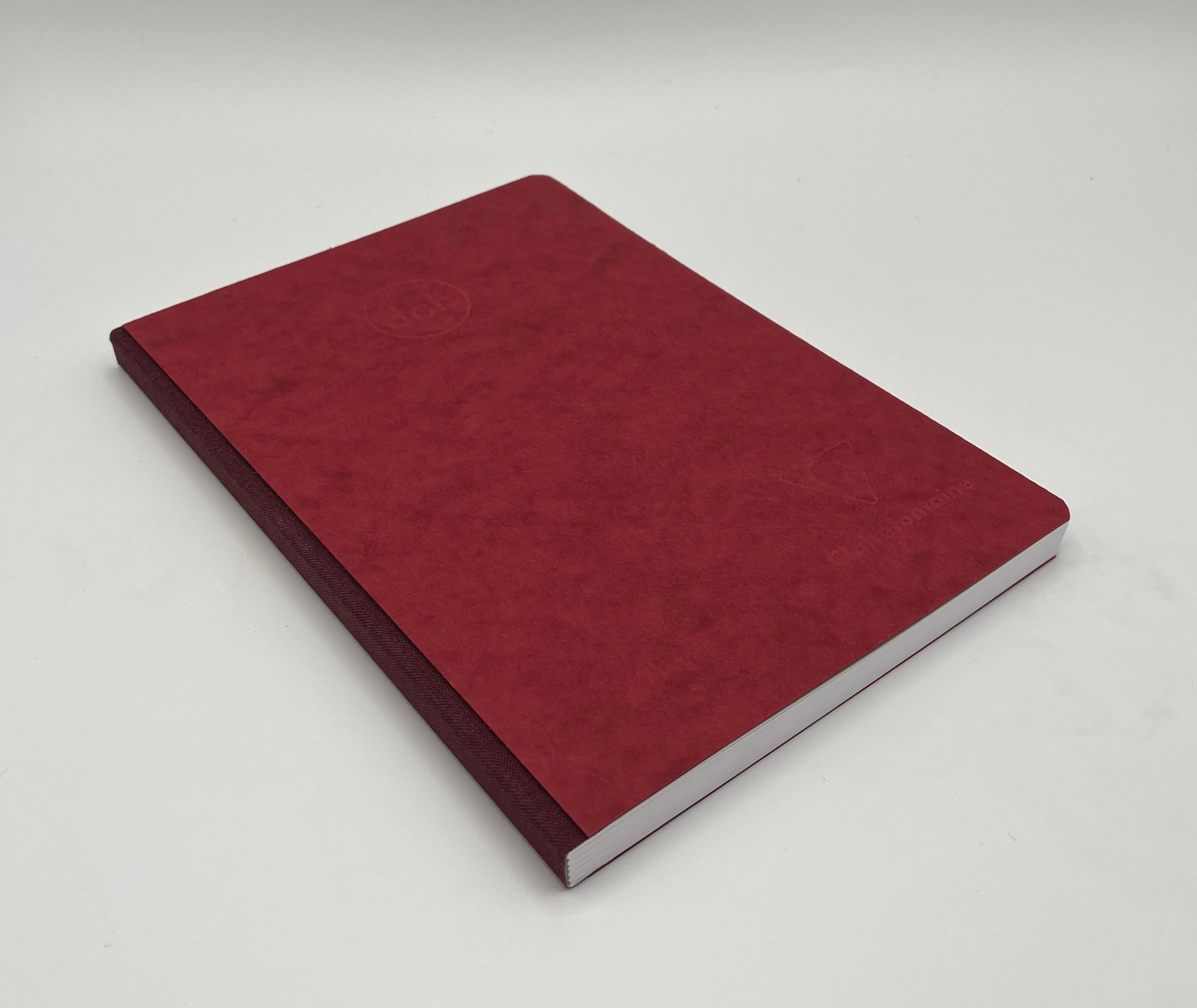 Red notebook on a white background