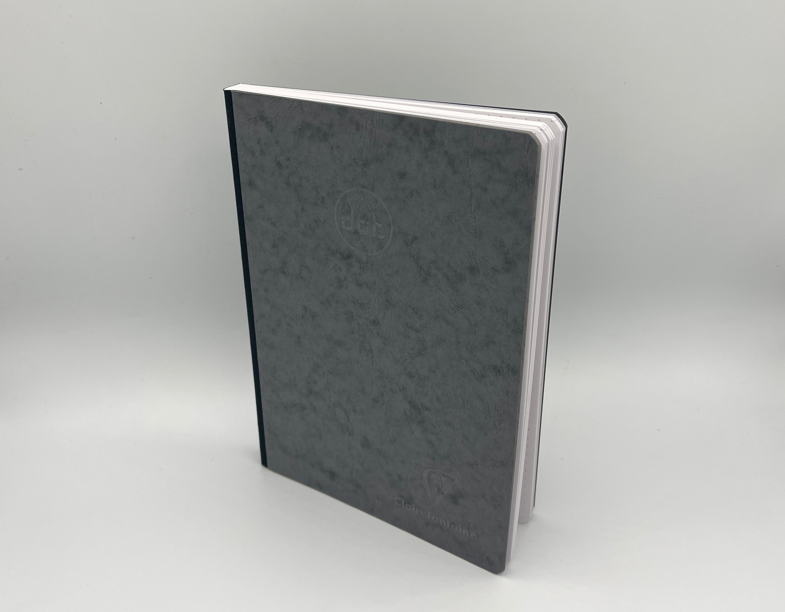 Gray notebook on a light gray background