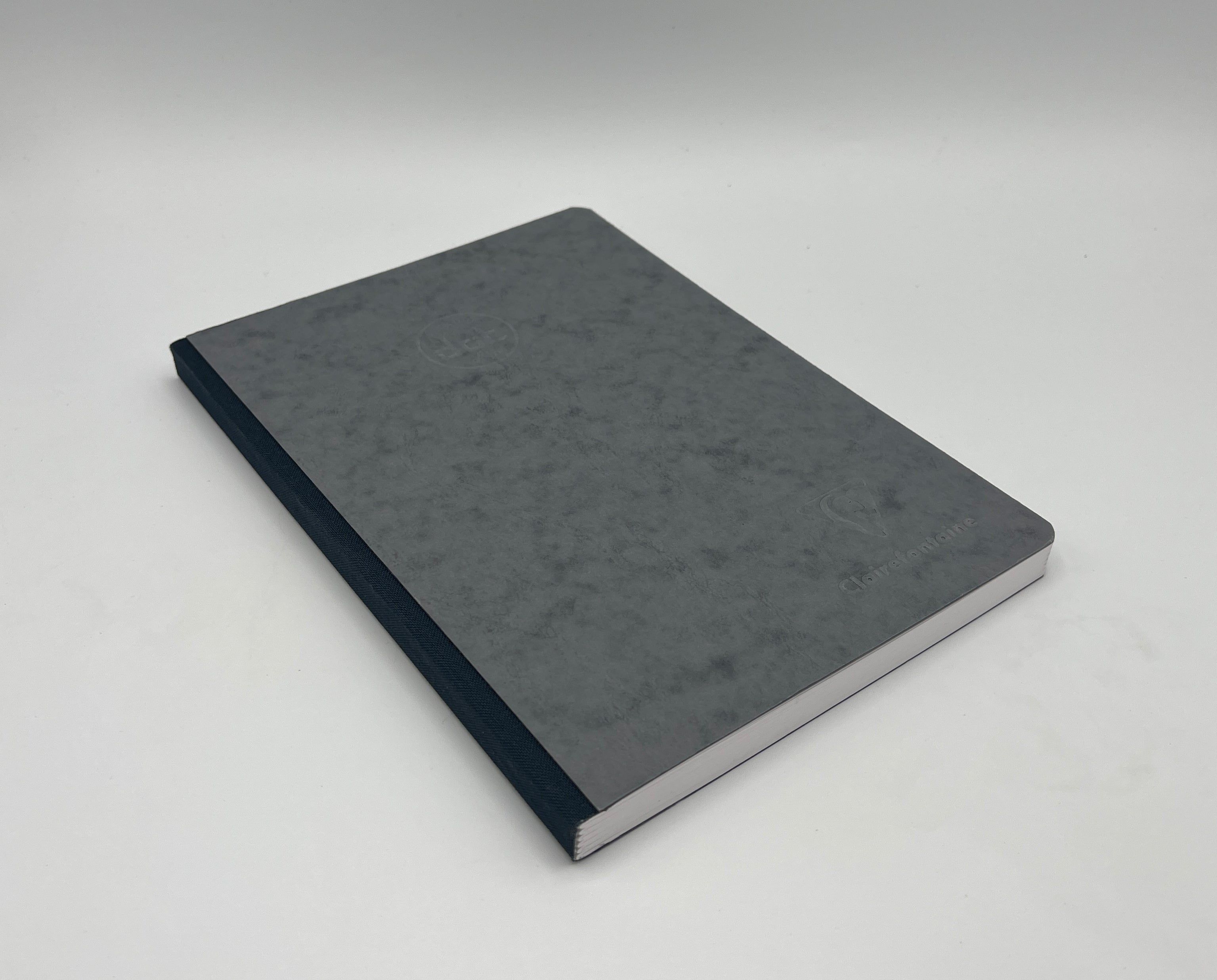 Gray notebook on a light gray background